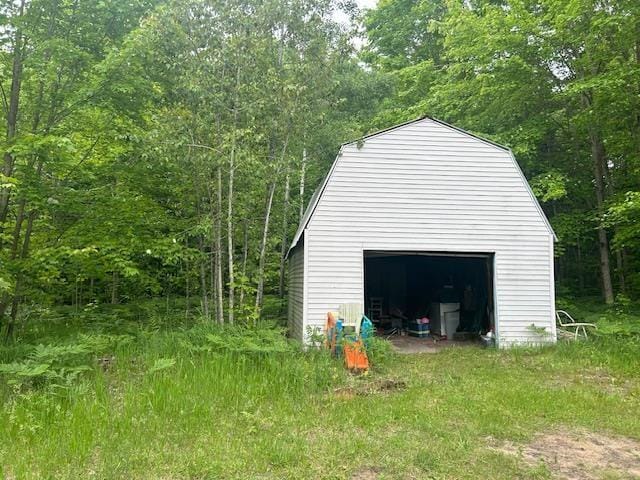 9540 Pickerel Lake Rd, Petoskey, MI 49770 - detached garage with a view of trees