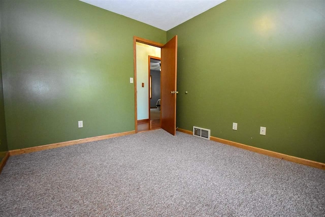 2335 Lone Pine Rd, Gaylord, MI 49735 - carpeted empty room featuring baseboards