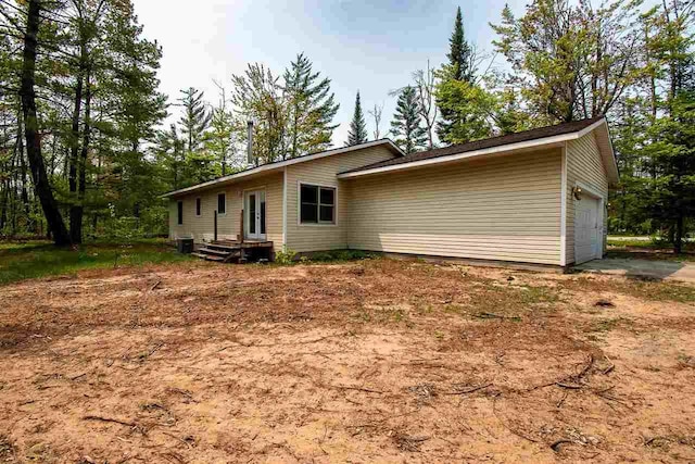 2335 Lone Pine Rd, Gaylord, MI 49735 - view of home's exterior featuring an attached garage