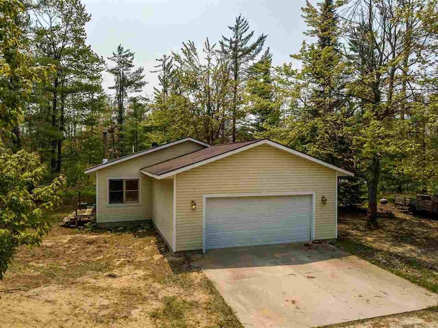2335 Lone Pine Rd, Gaylord, MI 49735 - garage featuring concrete driveway