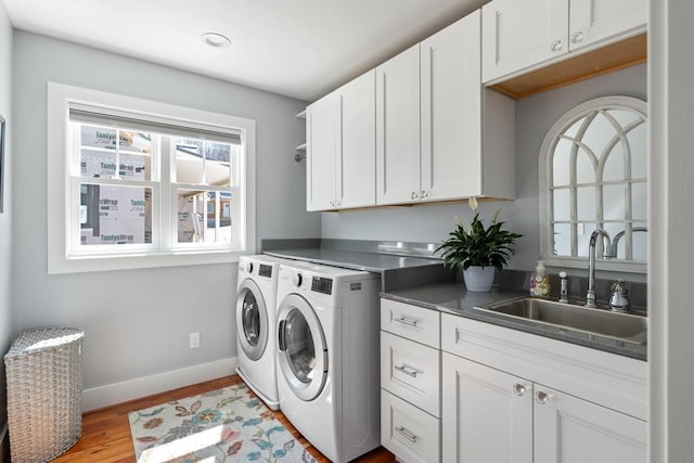 135 Beaubien Ave, Petoskey, MI 49770 - laundry room featuring washer and dryer, cabinet space, wood finished floors, and recessed lighting