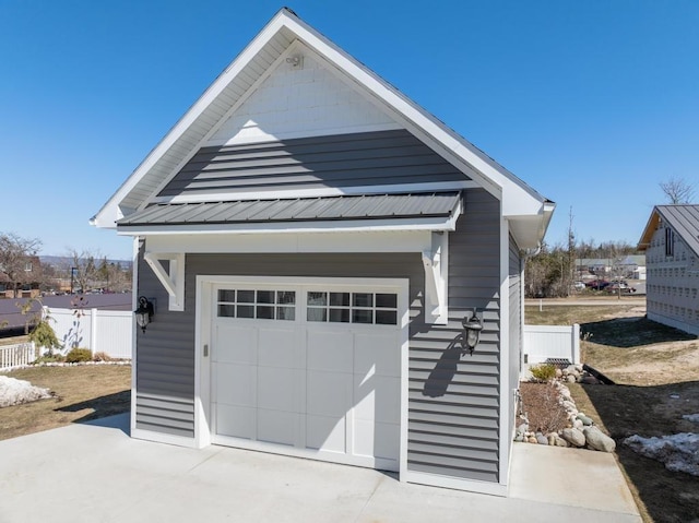 135 Beaubien Ave, Petoskey, MI 49770 - view of front facade featuring concrete driveway and a metal roof