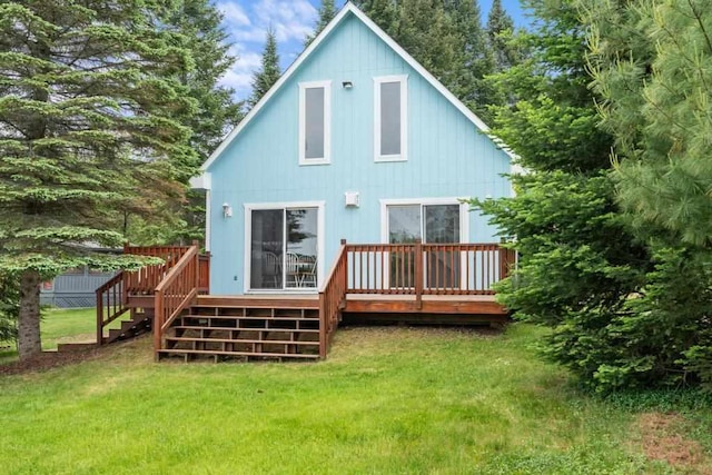 15700 Island Dr, Wolverine, MI 49799 - back of house with stairs, a yard, and a wooden deck