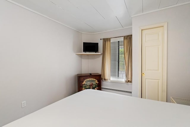 101 Michigan Ave Unit 107, Charlevoix, MI 49720 - bedroom with a baseboard heating unit and ornamental molding