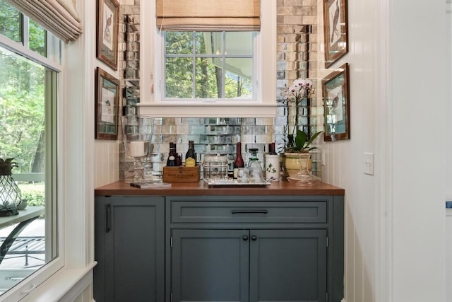 145 Traverse St, Harbor Springs, MI 49740 - indoor dry bar featuring decorative backsplash