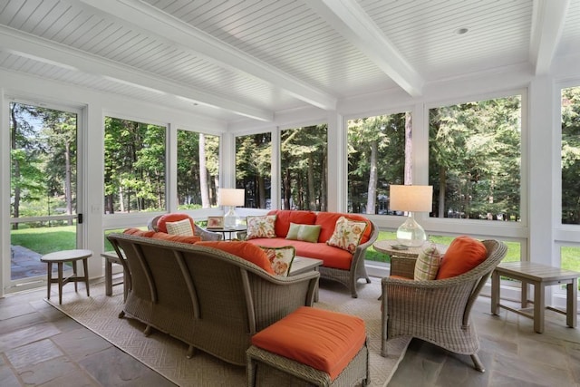 145 Traverse St, Harbor Springs, MI 49740 - sunroom / solarium featuring beamed ceiling, stone tile floors, and an outdoor living space