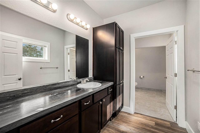 705 Maple Crk, Petoskey, MI 49770 - bathroom featuring vanity and wood finished floors