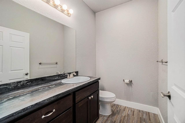 705 Maple Crk, Petoskey, MI 49770 - bathroom featuring vanity and wood finished floors