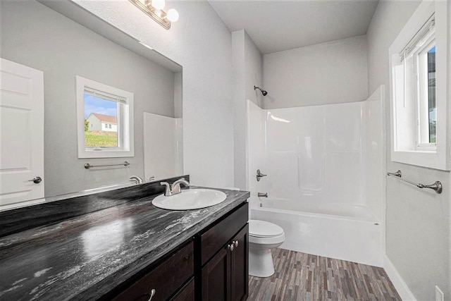 705 Maple Crk, Petoskey, MI 49770 - bathroom with vanity, wood finished floors, and tub / shower combination