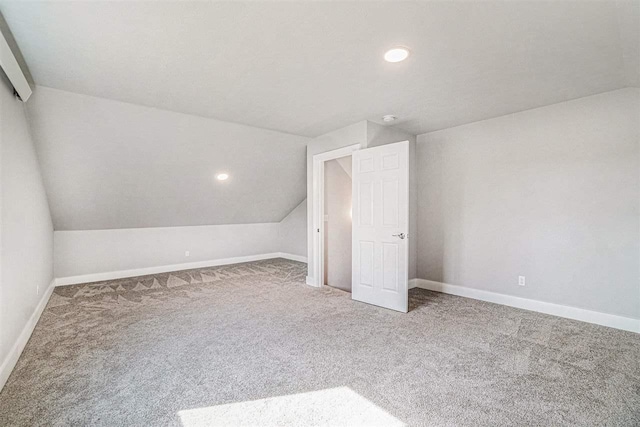 705 Maple Crk, Petoskey, MI 49770 - bonus room with vaulted ceiling, carpet floors, and recessed lighting