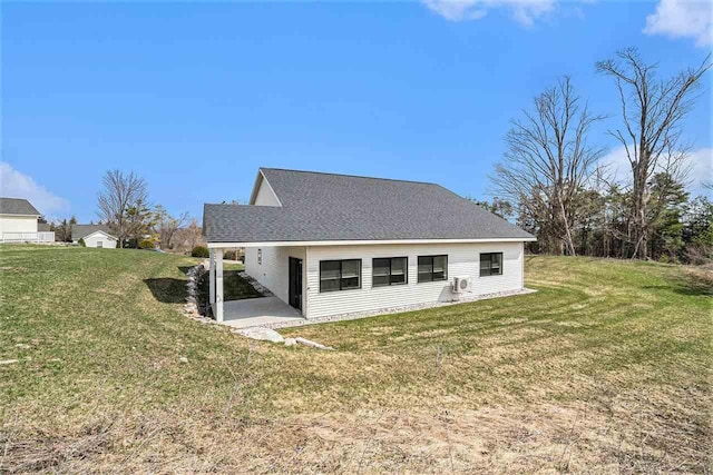 705 Maple Crk, Petoskey, MI 49770 - back of house featuring a yard and a patio
