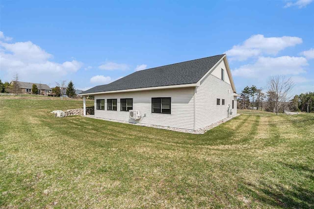 705 Maple Crk, Petoskey, MI 49770 - rear view of property with a yard