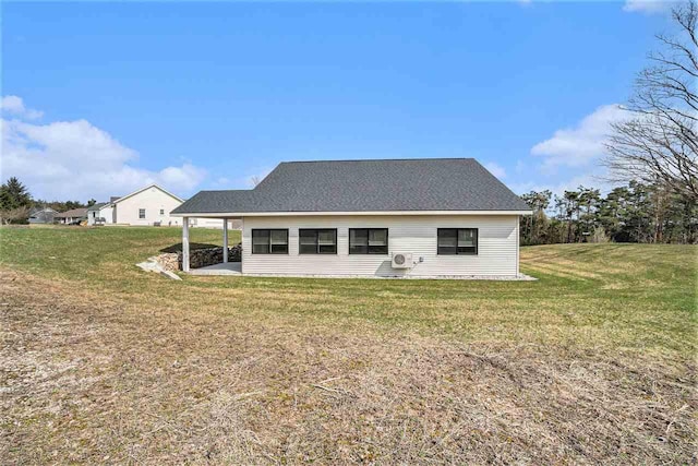 705 Maple Crk, Petoskey, MI 49770 - rear view of house with a yard and a patio