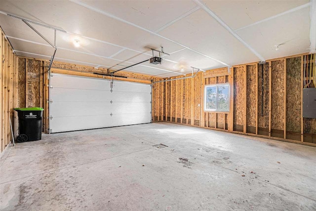 705 Maple Crk, Petoskey, MI 49770 - garage with a garage door opener and electric panel
