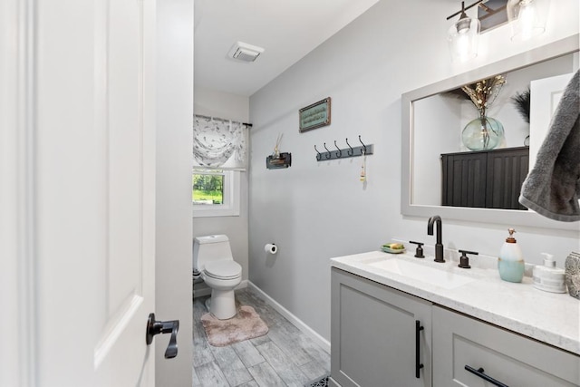 1116 N Lake St, Boyne City, MI 49712 - bathroom featuring vanity and wood finished floors