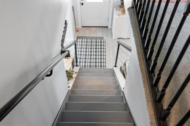 1116 N Lake St, Boyne City, MI 49712 - stairs featuring wood finished floors