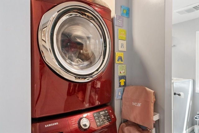 1116 N Lake St, Boyne City, MI 49712 - laundry area featuring estacked washer and dryer
