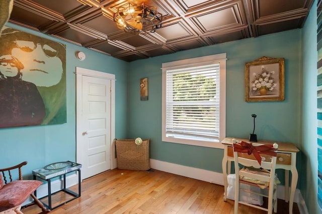 1116 N Lake St, Boyne City, MI 49712 - living area with light wood-style floors, an ornate ceiling, and a chandelier