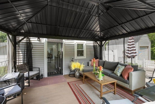 1116 N Lake St, Boyne City, MI 49712 - wooden deck featuring a gazebo and an outdoor living space