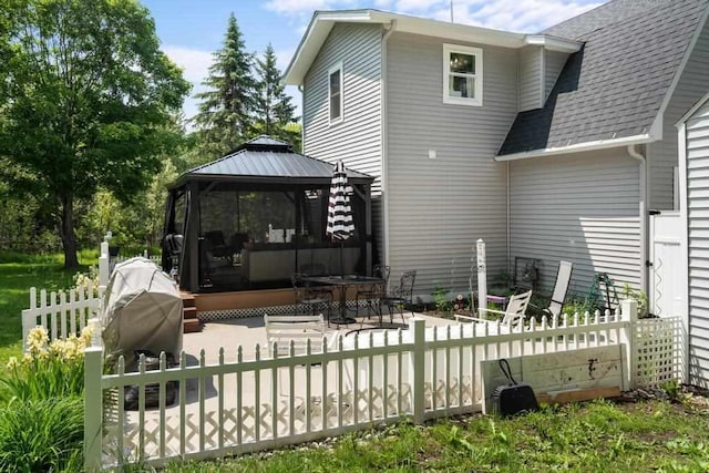 1116 N Lake St, Boyne City, MI 49712 - back of house featuring a gazebo, a shingled roof, and a patio