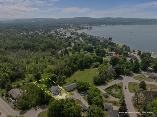1116 N Lake St, Boyne City, MI 49712 - aerial overview of property's location featuring a nearby body of water and property boundaries highlighted