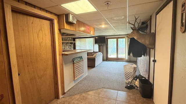 2160 Kladder Rd, Bellaire, MI 49615 - carpeted bedroom with a paneled ceiling and tile patterned floors