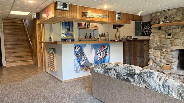 2160 Kladder Rd, Bellaire, MI 49615 - indoor dry bar with a paneled ceiling, stairs, carpet flooring, and tile patterned floors