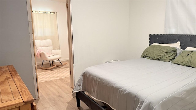 2160 Kladder Rd, Bellaire, MI 49615 - bedroom with light wood-style flooring