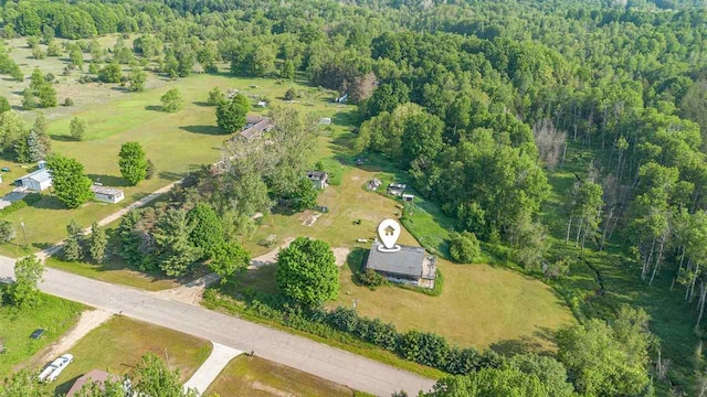 2160 Kladder Rd, Bellaire, MI 49615 - aerial overview of property's location with a heavily wooded area
