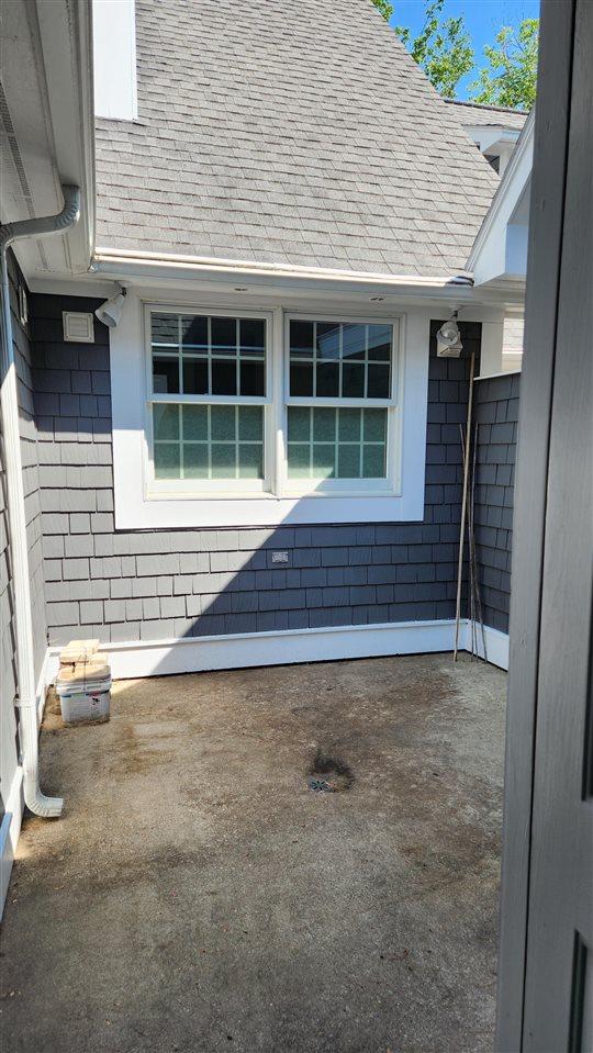 6069 Hills Cottage Ct Unit 5, Bay Harbor, MI 49770 - exterior view of roof with shingles
