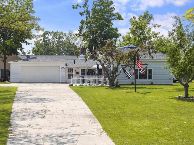 424 Carleton, Petoskey, MI 49770 - view of front of property with a front lawn, concrete driveway, a garage, and roof with shingles