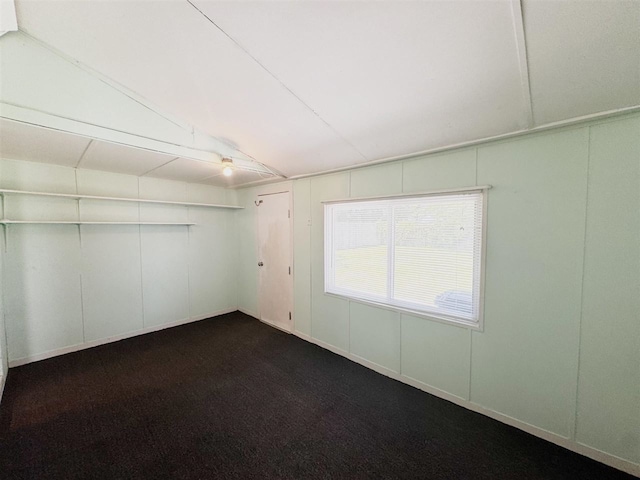 2343 Bonner Rd, Ferndale, MI 48220 - unfurnished room with dark colored carpet and a decorative wall