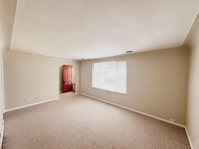 2343 Bonner Rd, Ferndale, MI 48220 - spare room featuring light carpet and arched walkways