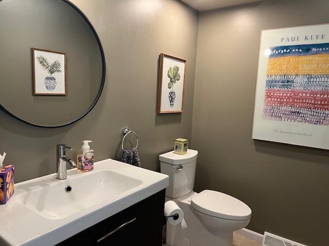 700 Fairways Dr Unit 14, Harbor Springs, MI 49740 - bathroom featuring toilet and vanity