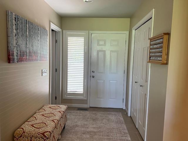 700 Fairways Dr Unit 14, Harbor Springs, MI 49740 - entrance foyer featuring tile patterned flooring