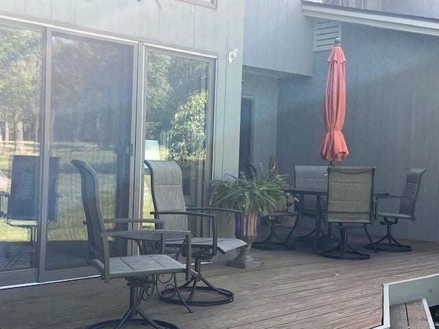 700 Fairways Dr Unit 14, Harbor Springs, MI 49740 - wooden deck featuring outdoor dining area