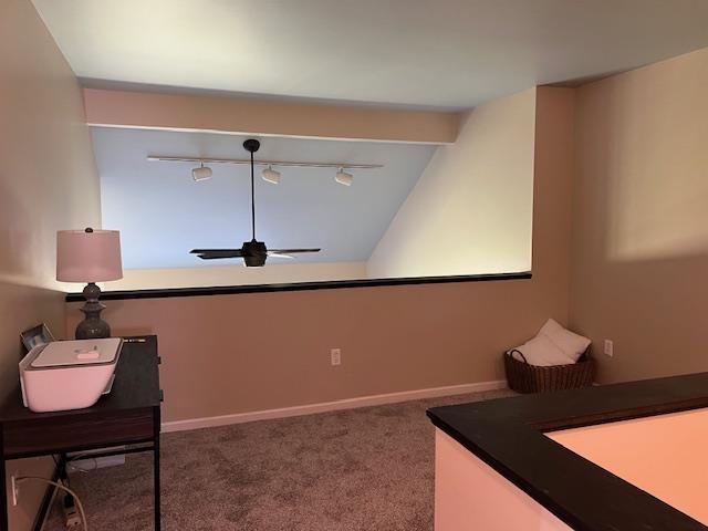 700 Fairways Dr Unit 14, Harbor Springs, MI 49740 - interior space with track lighting and lofted ceiling