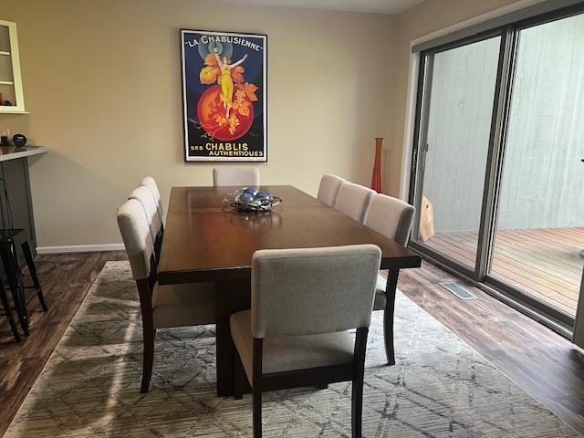 700 Fairways Dr Unit 14, Harbor Springs, MI 49740 - dining space featuring wood finished floors and baseboards