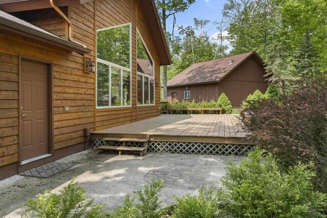 6989 Meadowlark Way, Gaylord, MI 49735 - view of patio featuring a deck
