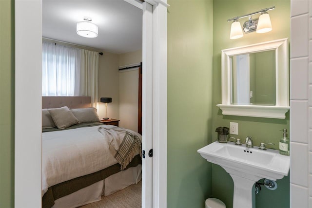 606 State St, Petoskey, MI 49770 - carpeted bedroom with a sink