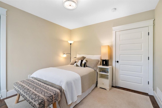 606 State St, Petoskey, MI 49770 - bedroom with baseboards and wood finished floors