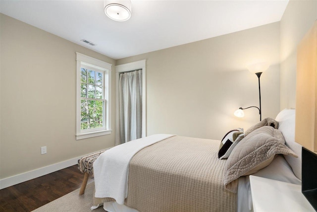 606 State St, Petoskey, MI 49770 - bedroom with baseboards and wood finished floors