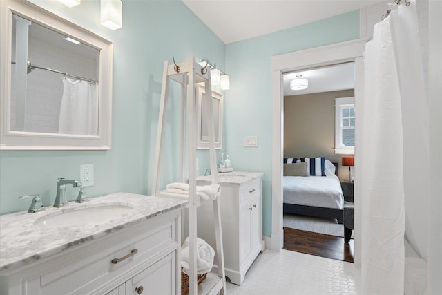 606 State St, Petoskey, MI 49770 - full bath with vanity, connected bathroom, and tile patterned flooring