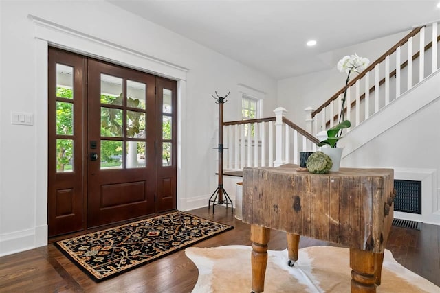 606 State St, Petoskey, MI 49770 - foyer entrance with wood finished floors, recessed lighting, and stairway