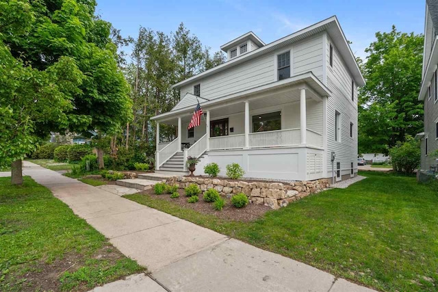 606 State St, Petoskey, MI 49770 - traditional style home with a porch, a front lawn, and stairway