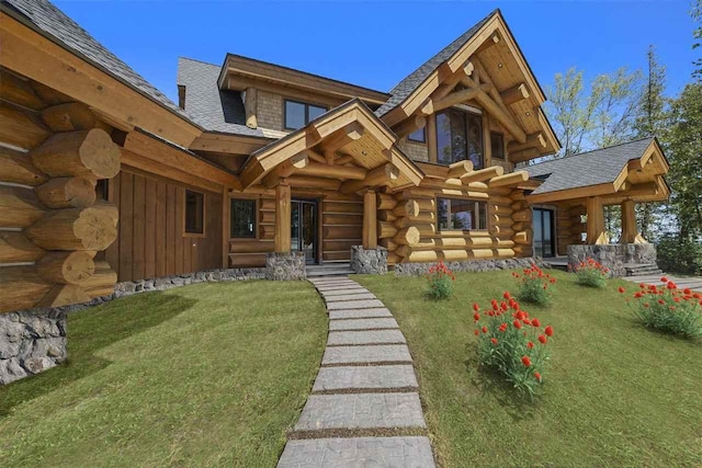 7177 Albany Point Rd, Presque Isle, MI 49777 - rear view of property with log siding, a yard, and roof with shingles