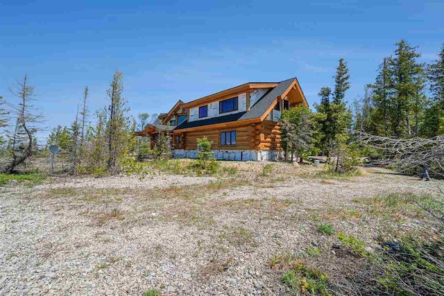 7177 Albany Point Rd, Presque Isle, MI 49777 - view of side of property with log exterior