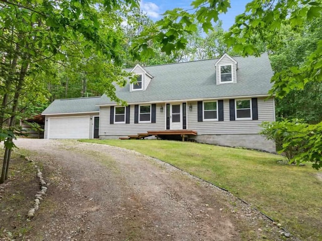 3049 Chippewa Beach Rd, Indian River, MI 49749 - cape cod house featuring driveway, a garage, a front yard, and roof with shingles