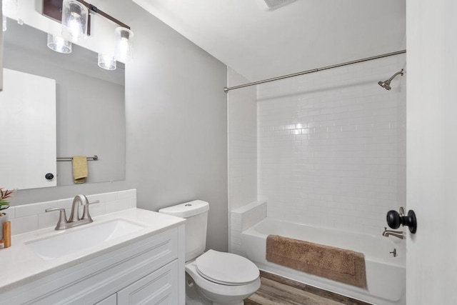3049 Chippewa Beach Rd, Indian River, MI 49749 - bathroom featuring vanity, bathtub / shower combination, and wood finished floors