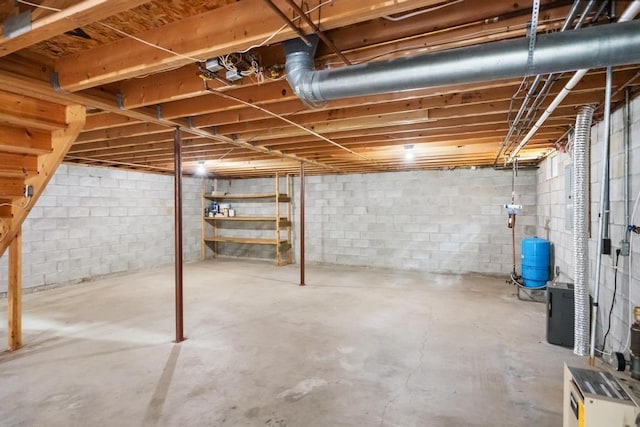 3049 Chippewa Beach Rd, Indian River, MI 49749 - unfinished basement with a water pressure tank and concrete block wall